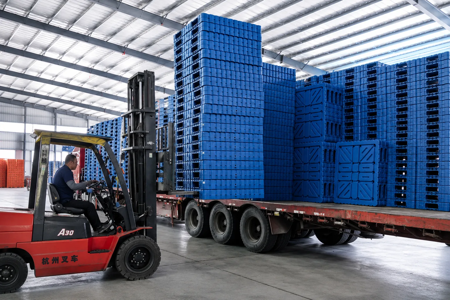 Plastic pallets being loaded for delivery
