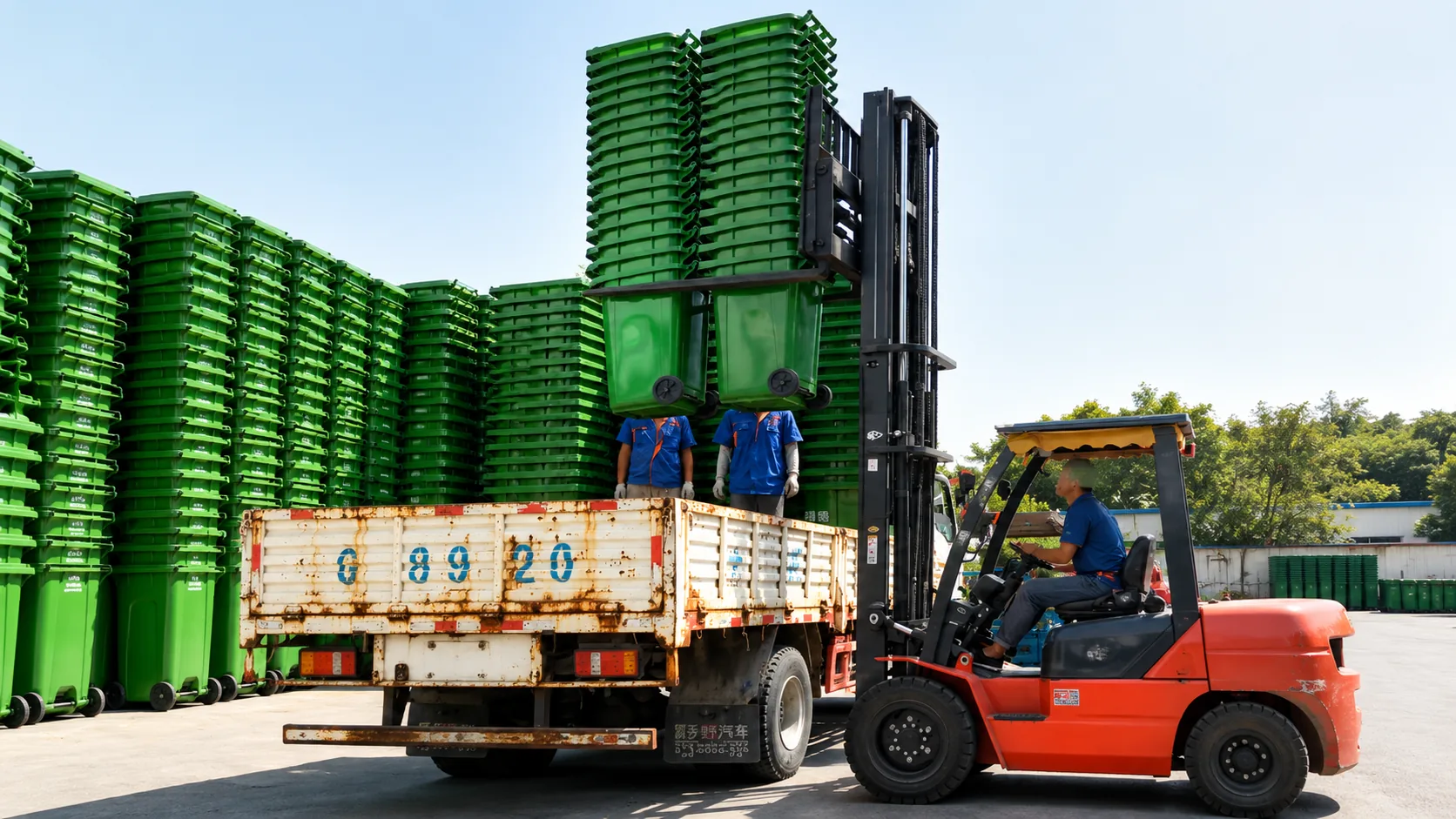 Plastic trash cans organized for loading and delivery